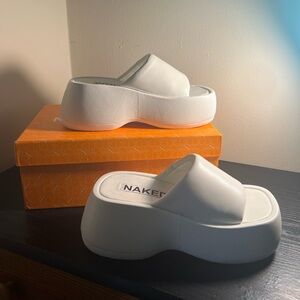 NAKED WOLFE PLATFORM SLIDES